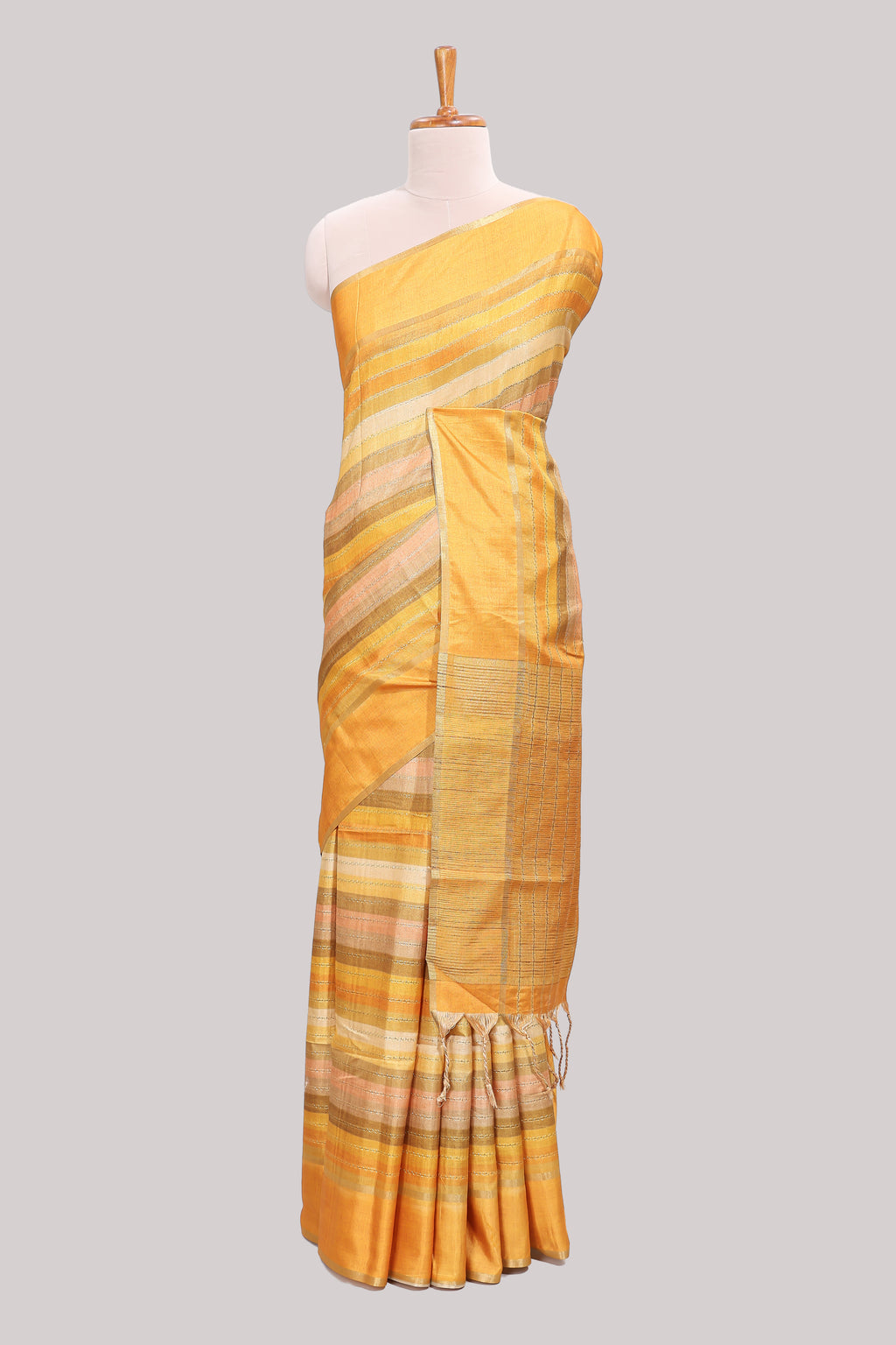 Yellow striped tussar saree with self border and pallu that comes with matching blouse