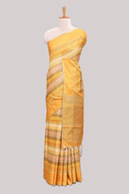 Yellow striped tussar saree with self border and pallu that comes with matching blouse
