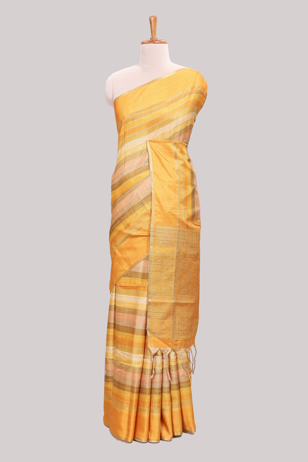 Yellow striped tussar saree with self border and pallu that comes with matching blouse