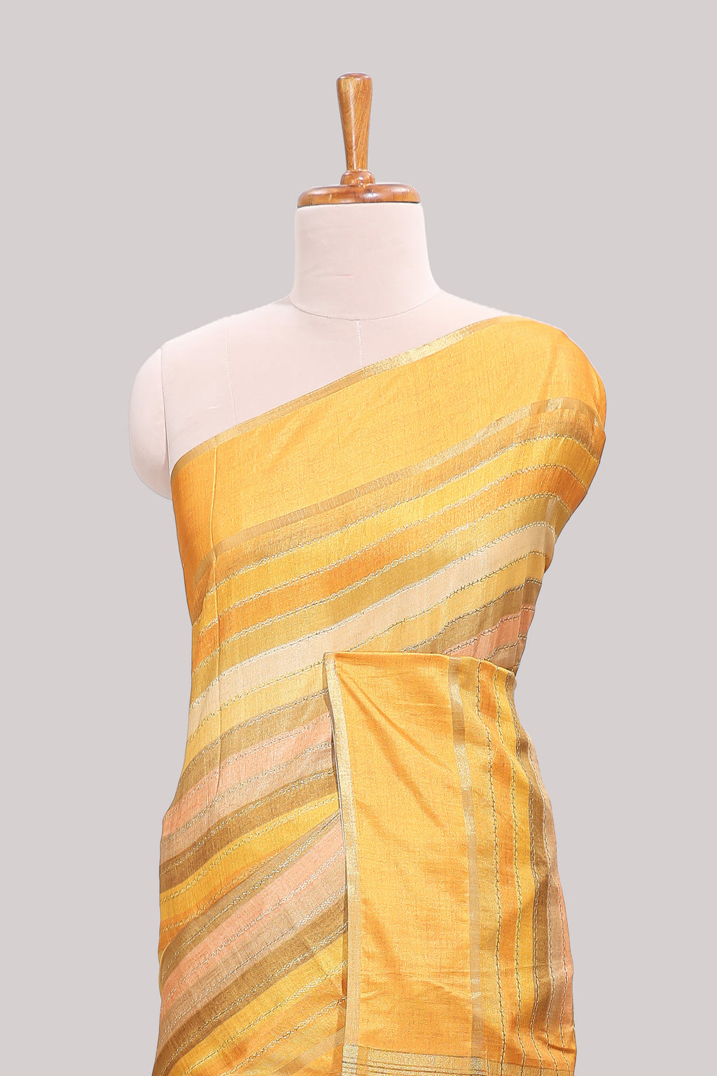 Yellow striped tussar saree with self border and pallu that comes with matching blouse