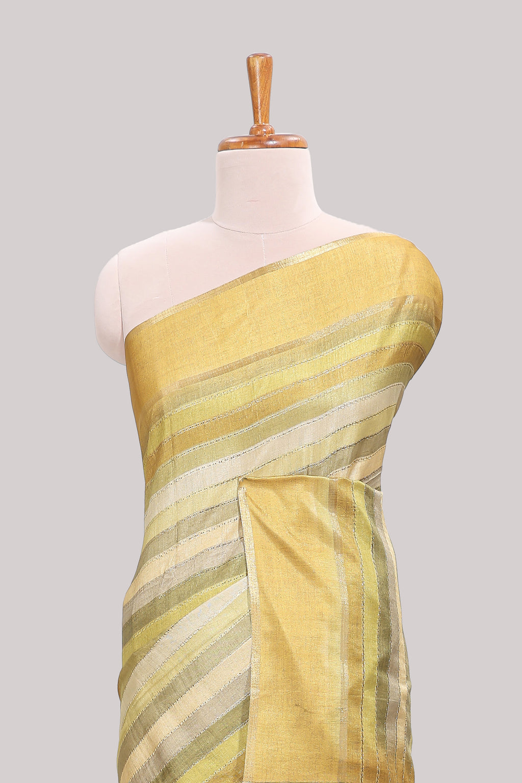 Lime yellow striped tussar saree with self border and pallu that comes with matching blouse