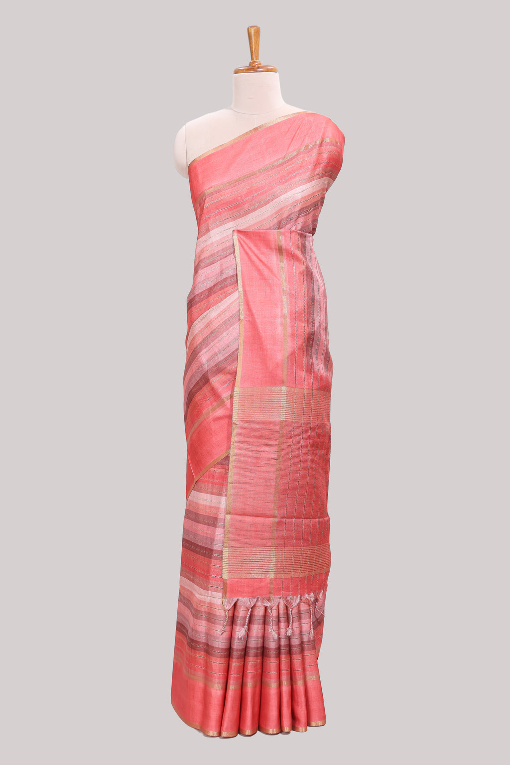 Peach striped tussar saree with self border and pallu that comes with matching blouse