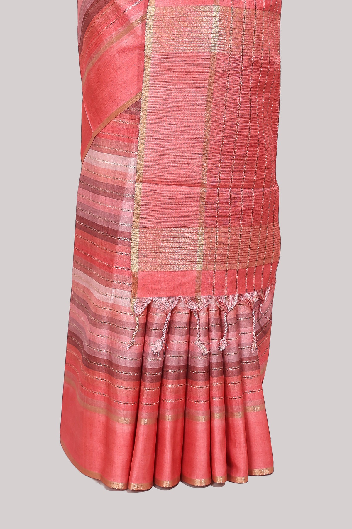 Peach striped tussar saree with self border and pallu that comes with matching blouse