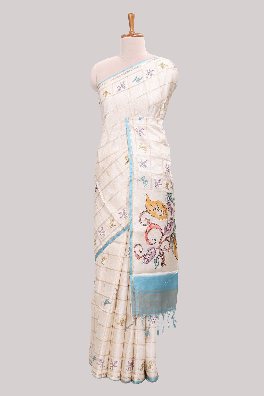 Off white checked tussar saree with contrast border and self pallu that comes with matching blouse
