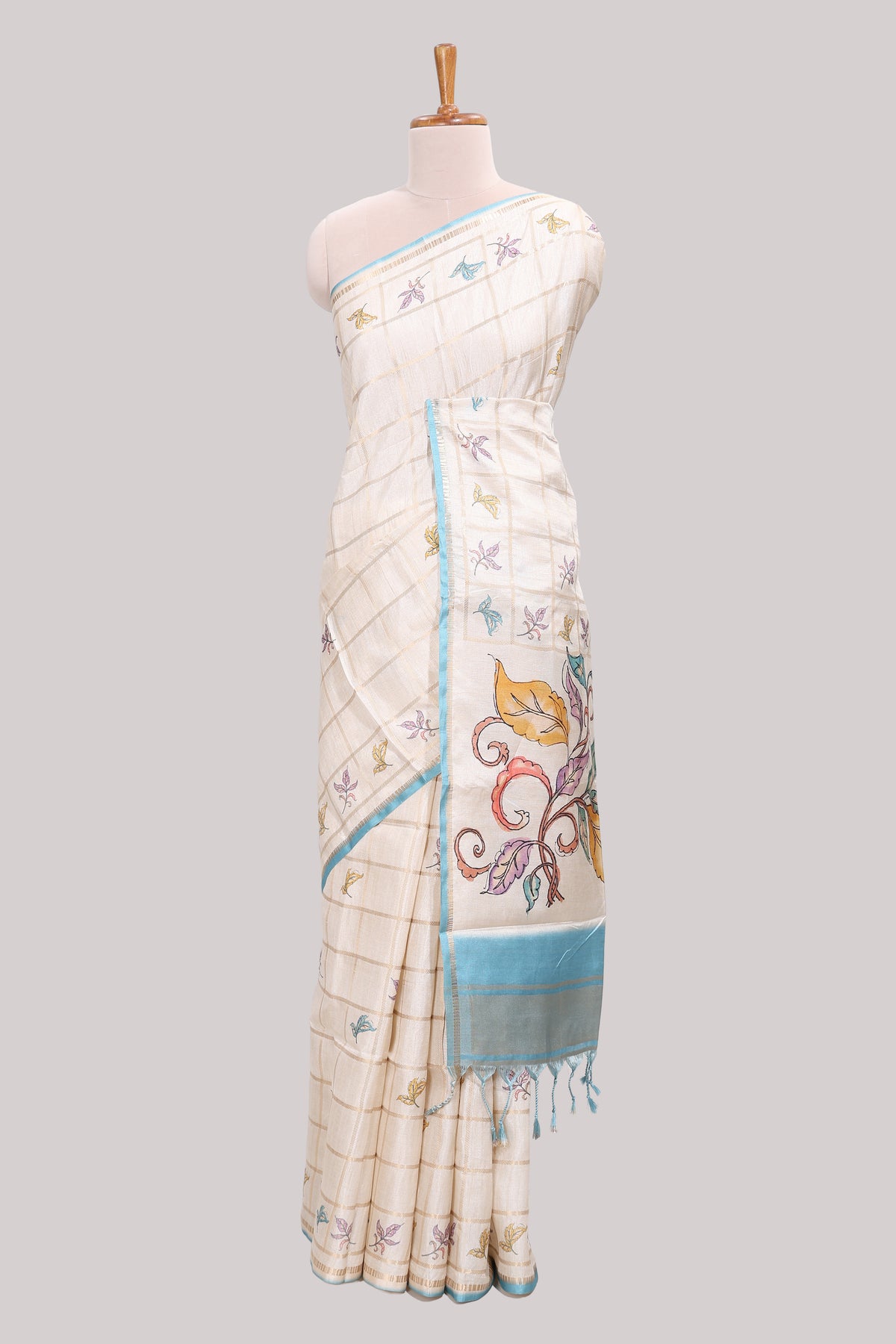 Off white checked tussar saree with contrast border and self pallu that comes with matching blouse