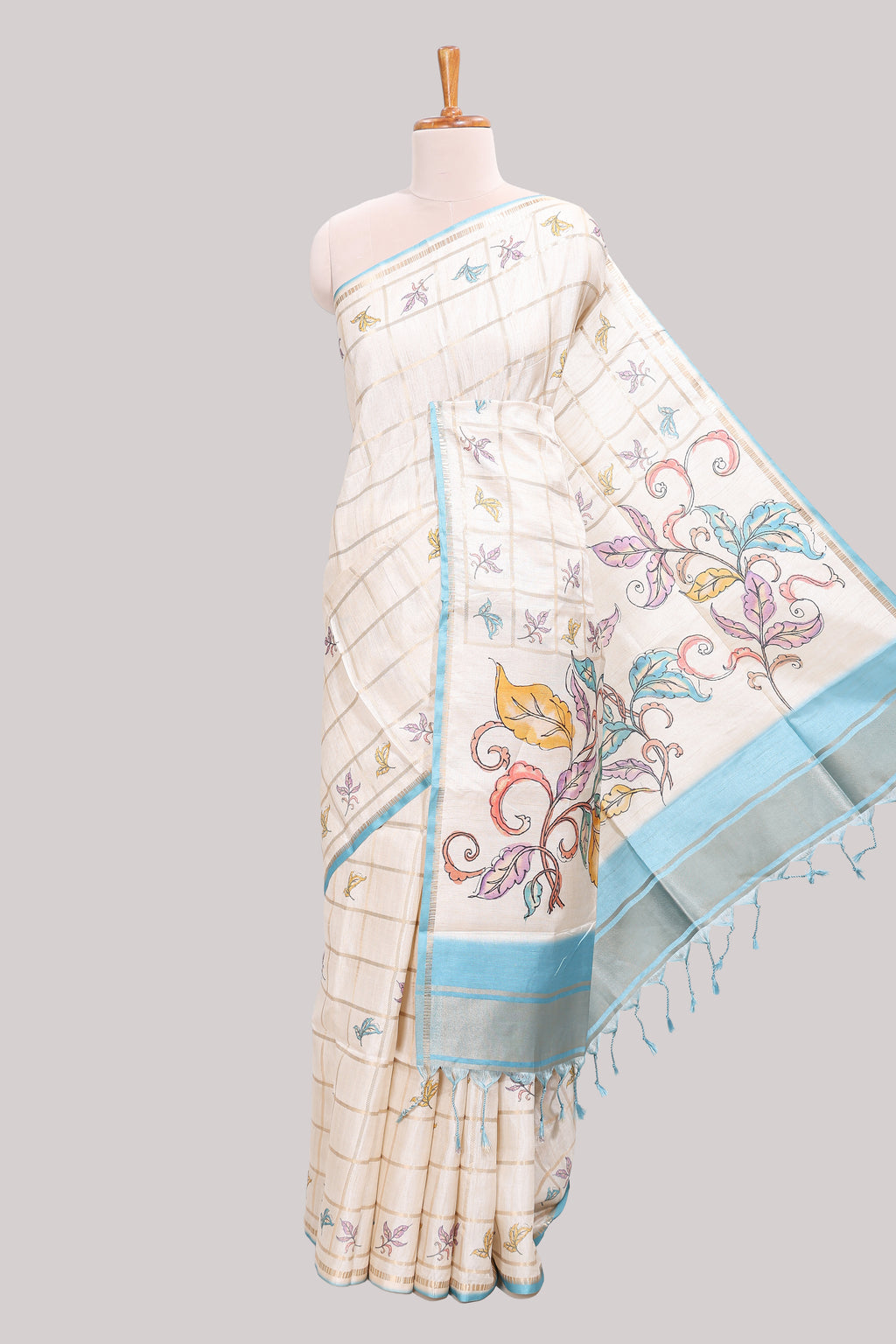 Off white checked tussar saree with contrast border and self pallu that comes with matching blouse