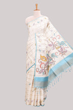 Off white checked tussar saree with contrast border and self pallu that comes with matching blouse