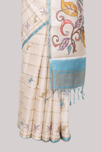 Off white checked tussar saree with contrast border and self pallu that comes with matching blouse