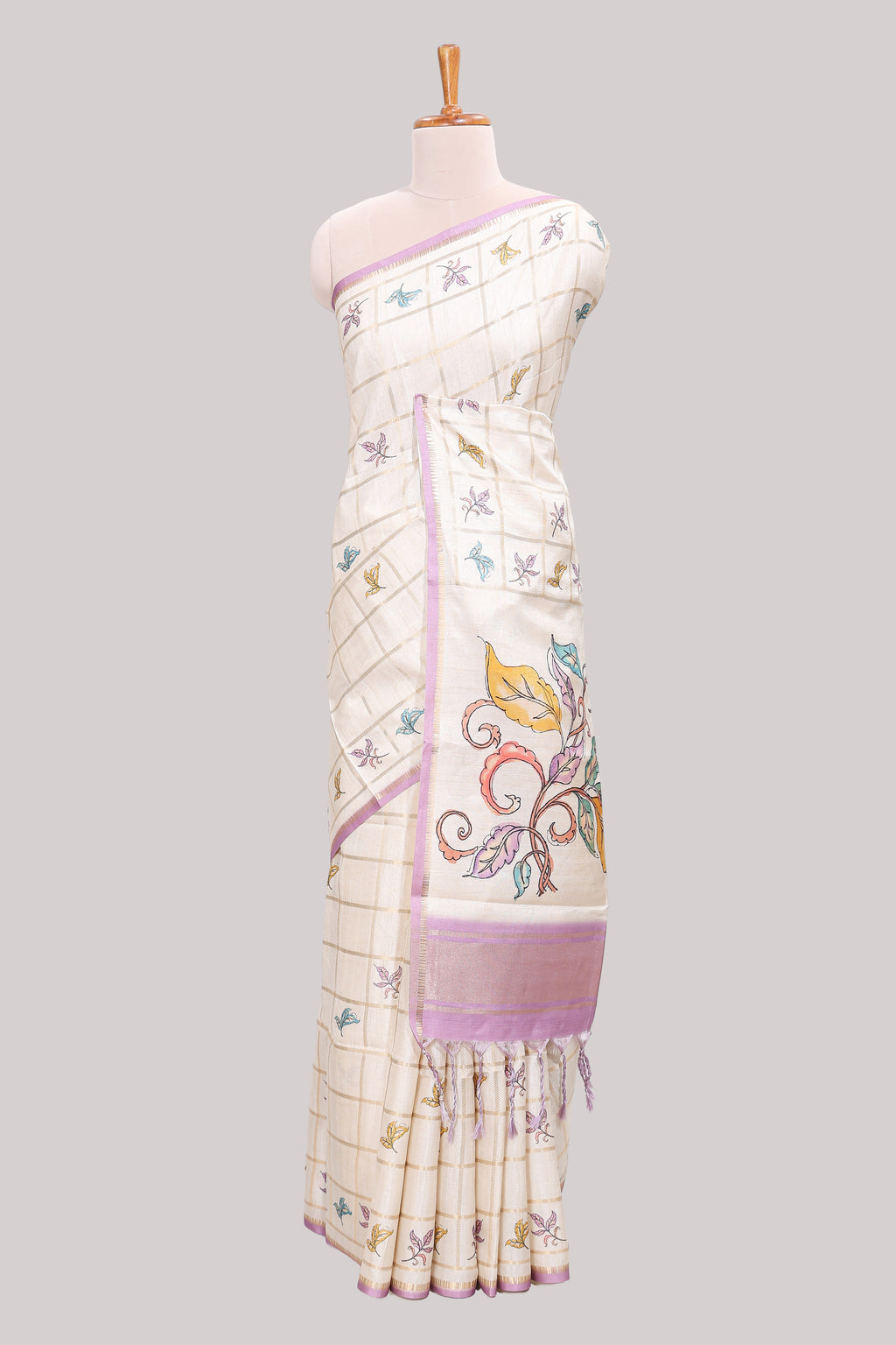 Off white checked tussar saree with contrast border and self pallu that comes with matching floral blouse