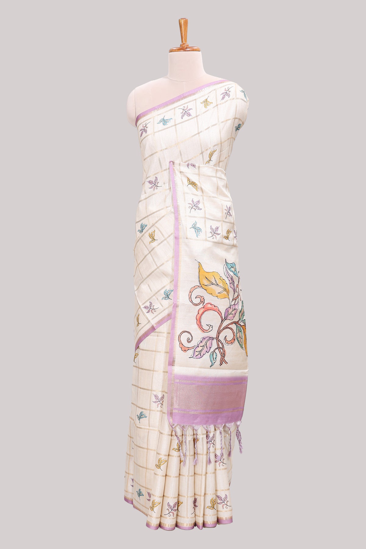 Off white checked tussar saree with contrast border and self pallu that comes with matching floral blouse