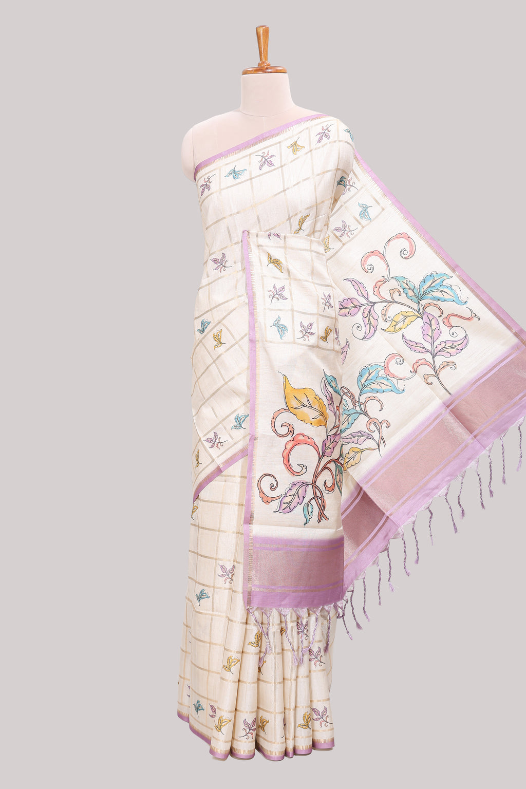 Off white checked tussar saree with contrast border and self pallu that comes with matching floral blouse