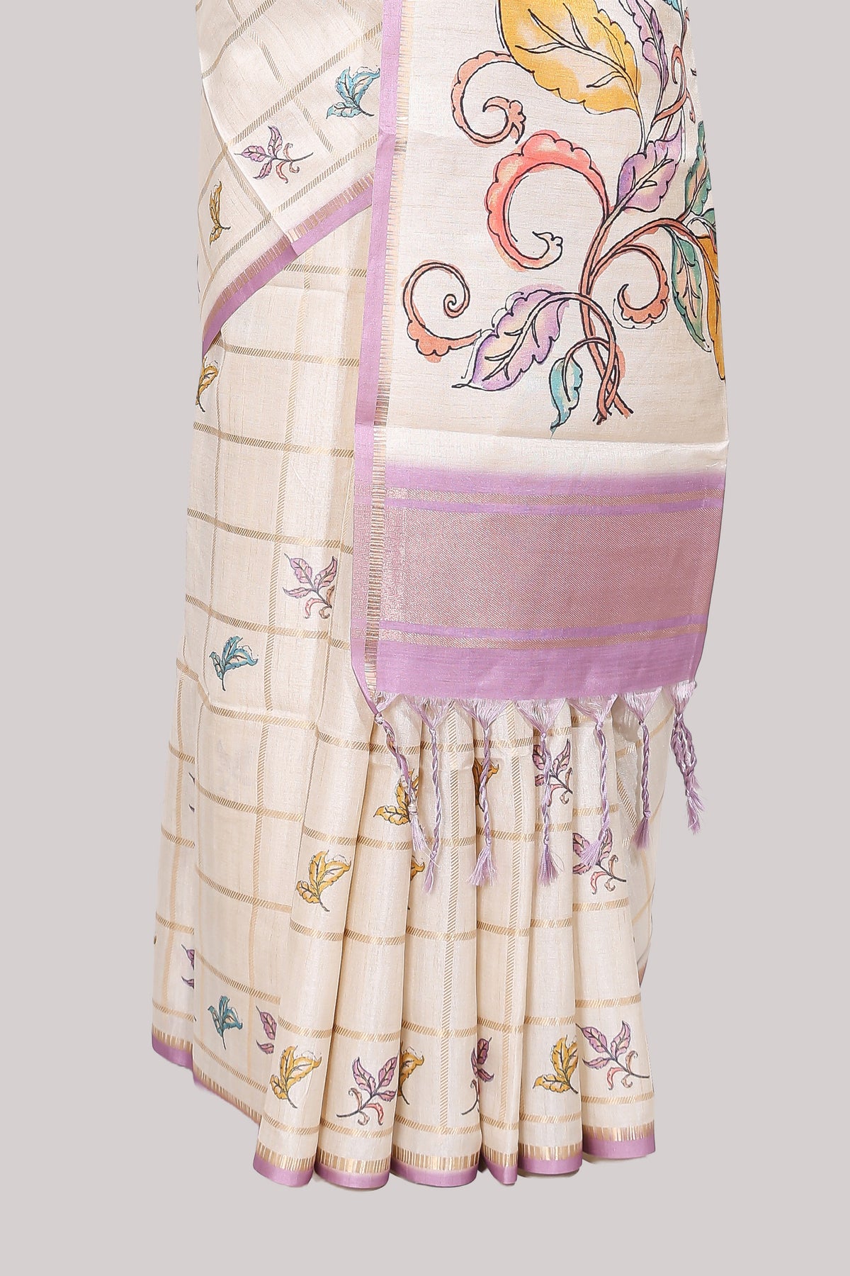 Off white checked tussar saree with contrast border and self pallu that comes with matching floral blouse