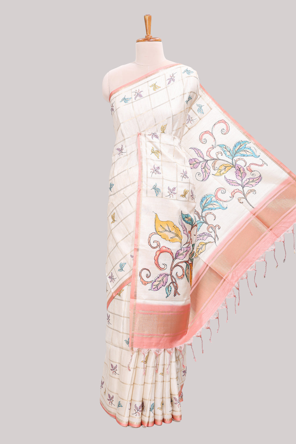 Off white checked tussar saree with contrast border and peach self pallu that comes with matching floral blouse