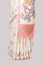 Off white checked tussar saree with contrast border and peach self pallu that comes with matching floral blouse