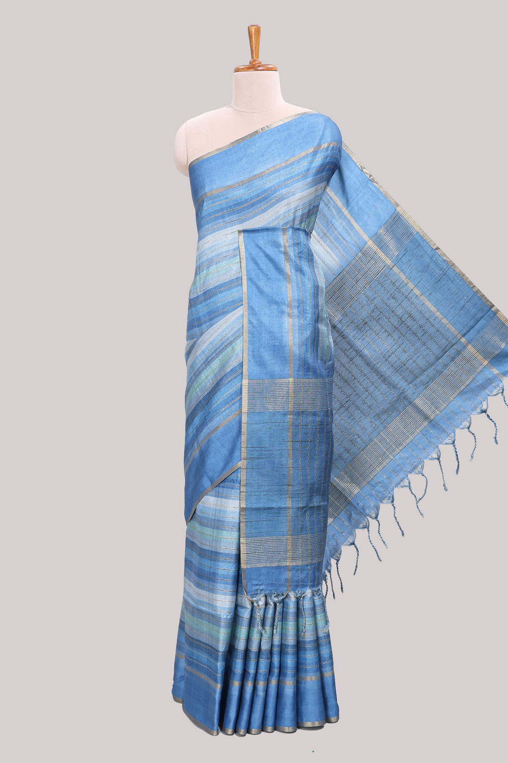 Blue striped tussar saree with self border and pallu that comes with matching blouse