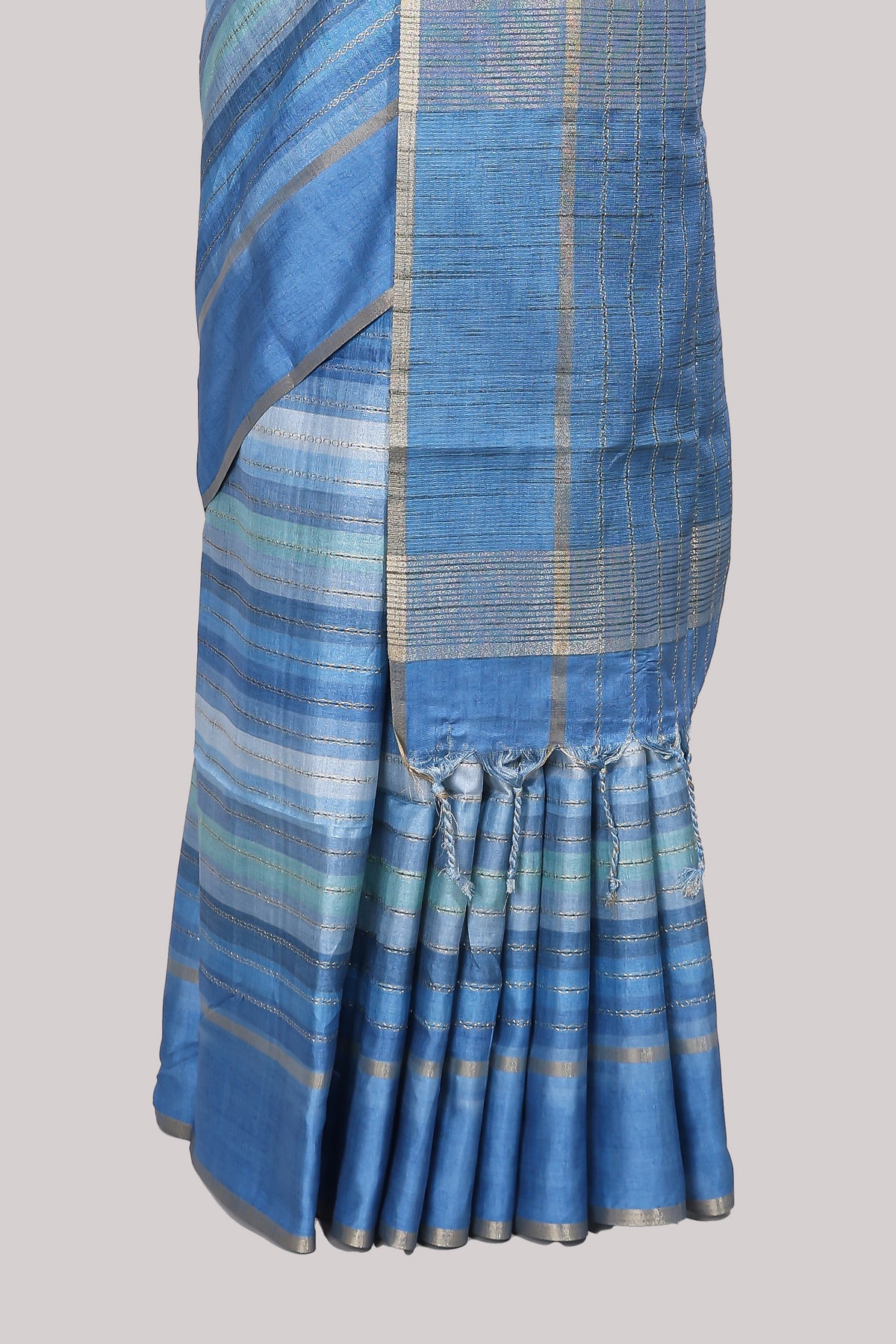 Blue striped tussar saree with self border and pallu that comes with matching blouse