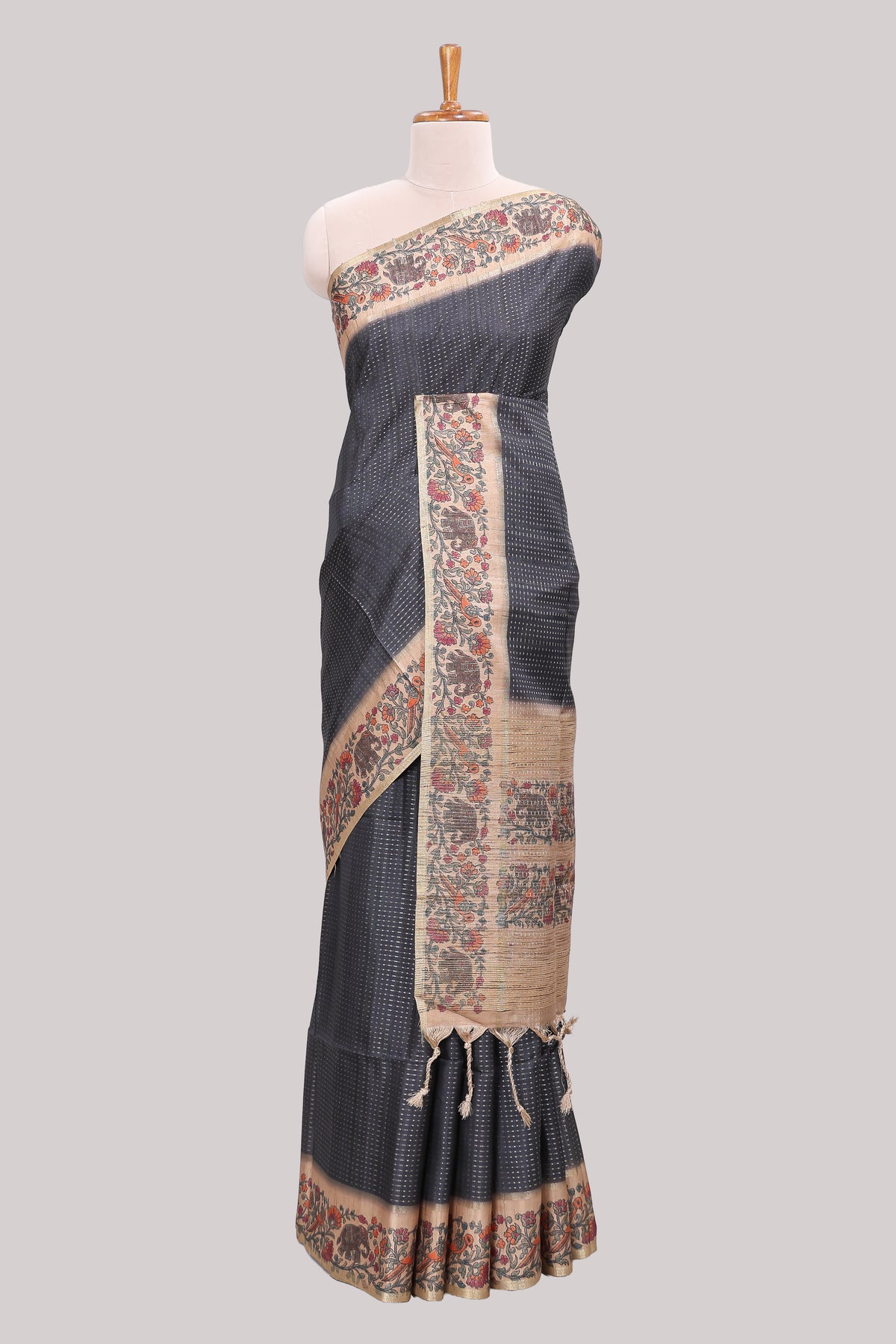 Black striped tussar saree with contrast border and pallu that comes with plain blouse