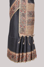 Black striped tussar saree with contrast border and pallu that comes with plain blouse