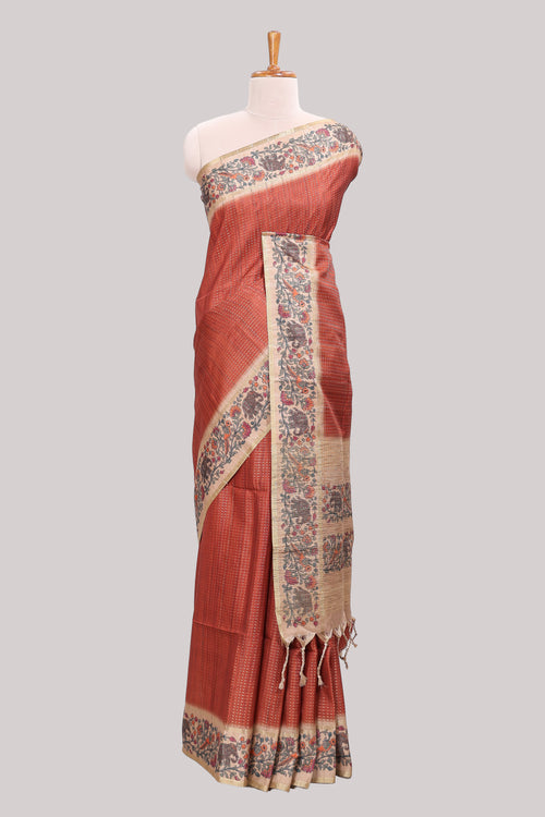 Rust striped tussar saree with contrast border and pallu that comes with plain blouse