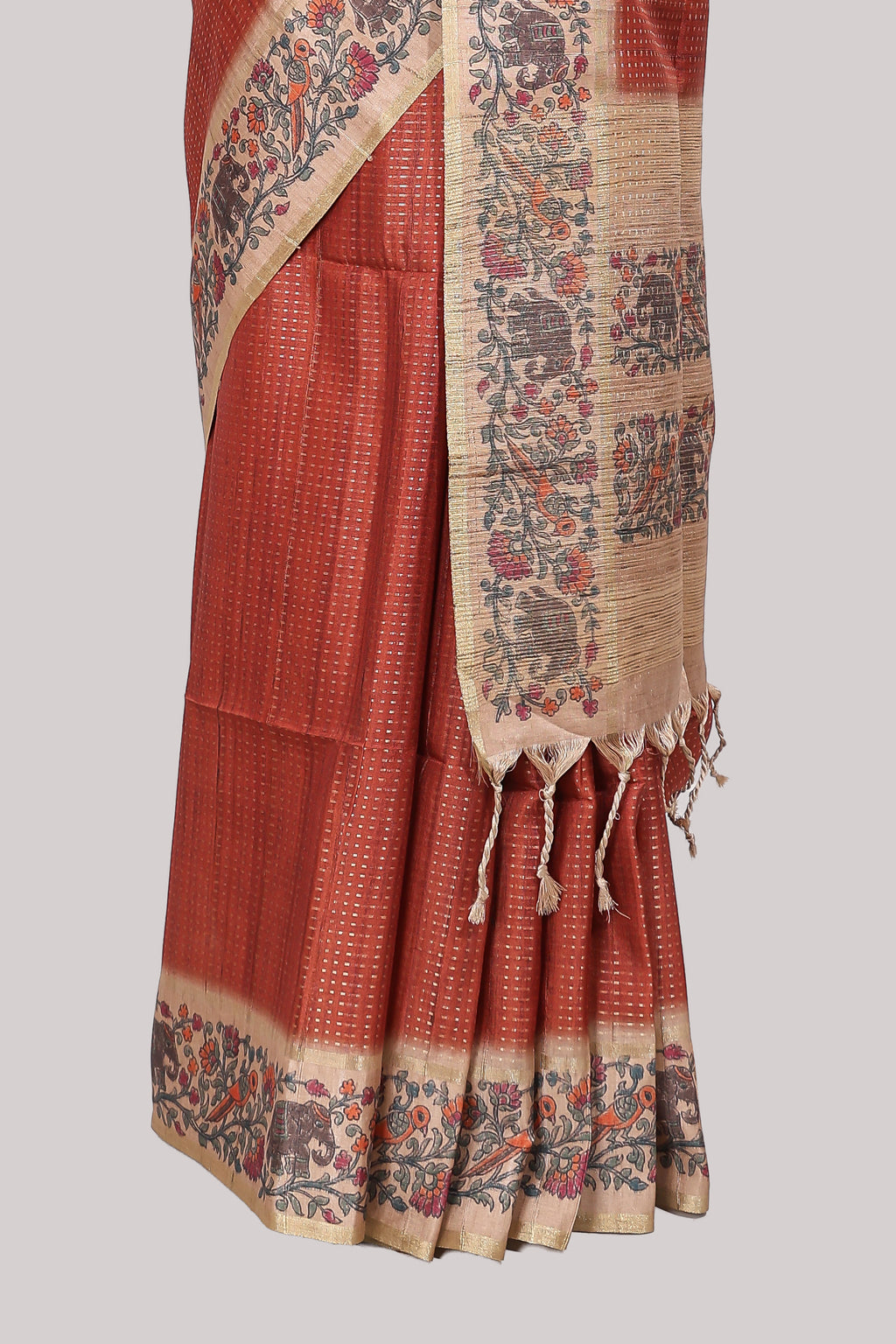 Rust striped tussar saree with contrast border and pallu that comes with plain blouse