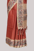 Rust striped tussar saree with contrast border and pallu that comes with plain blouse