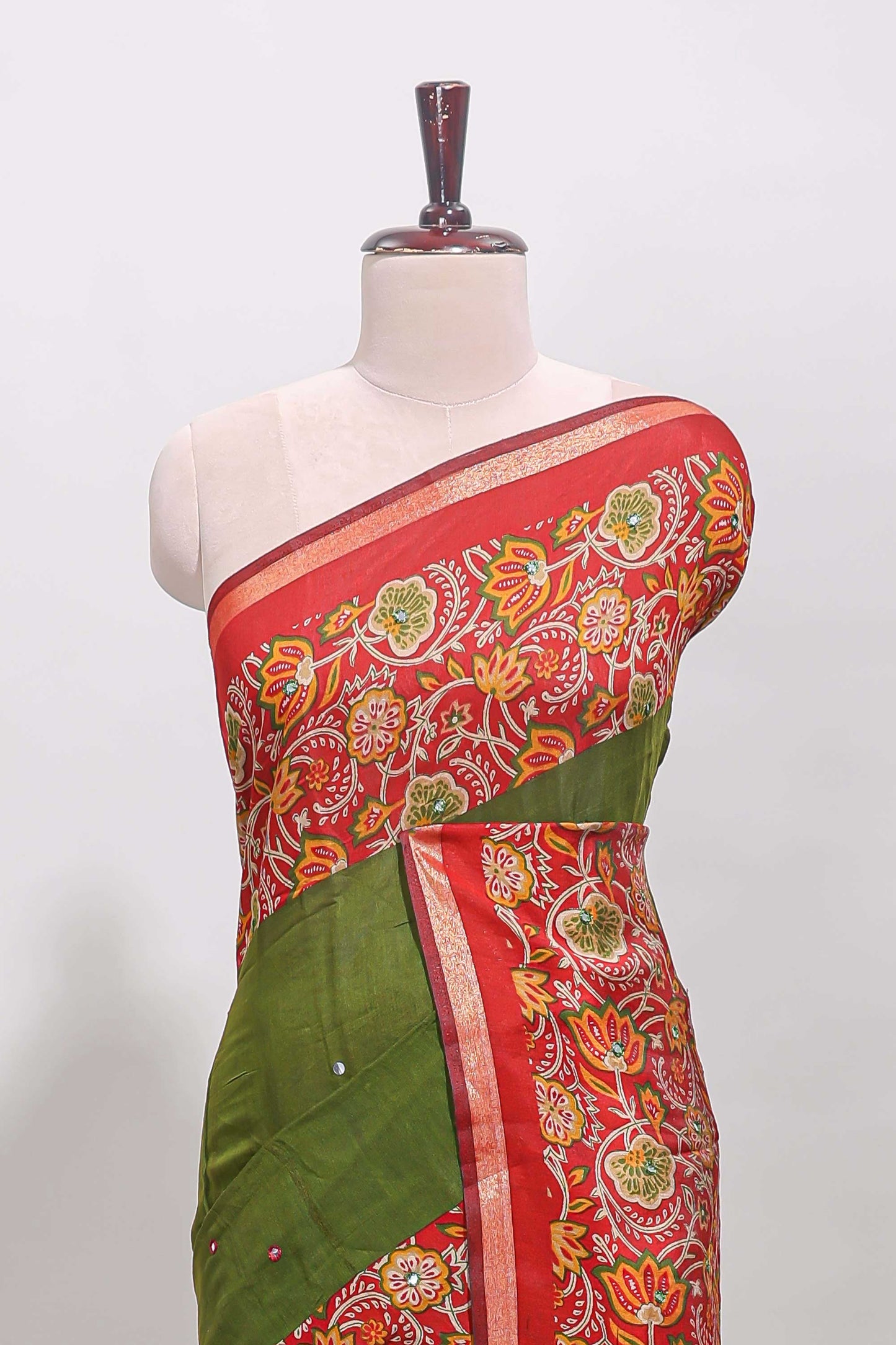Green embroidery mirror work viscose georgette saree with contrast floral vine zari border and printed blouse