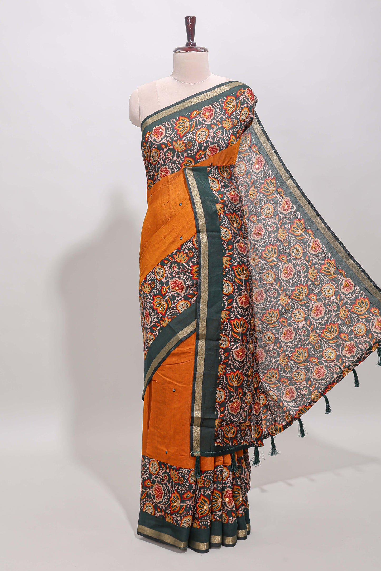 Mustard yellow embroidery mirror work viscose georgette saree with contrast floral vine zari border and printed blouse