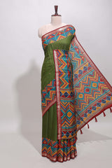 Green embroidery mirror work viscose georgette saree with contrast chevron design zari border and printed pallu