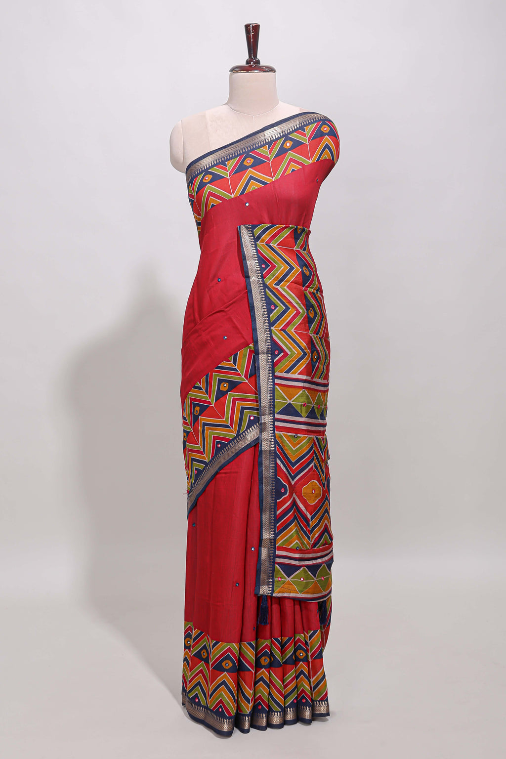 Red embroidery mirror work viscose georgette saree with contrast chevron design zari border and printed pallu
