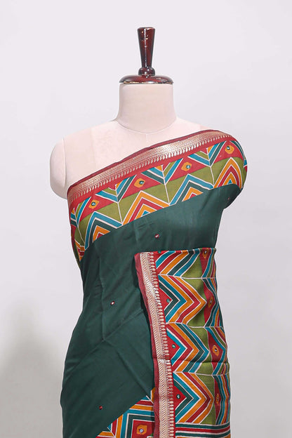 Green embroidery mirror work viscose georgette saree with contrast chevron design zari border and printed pallu