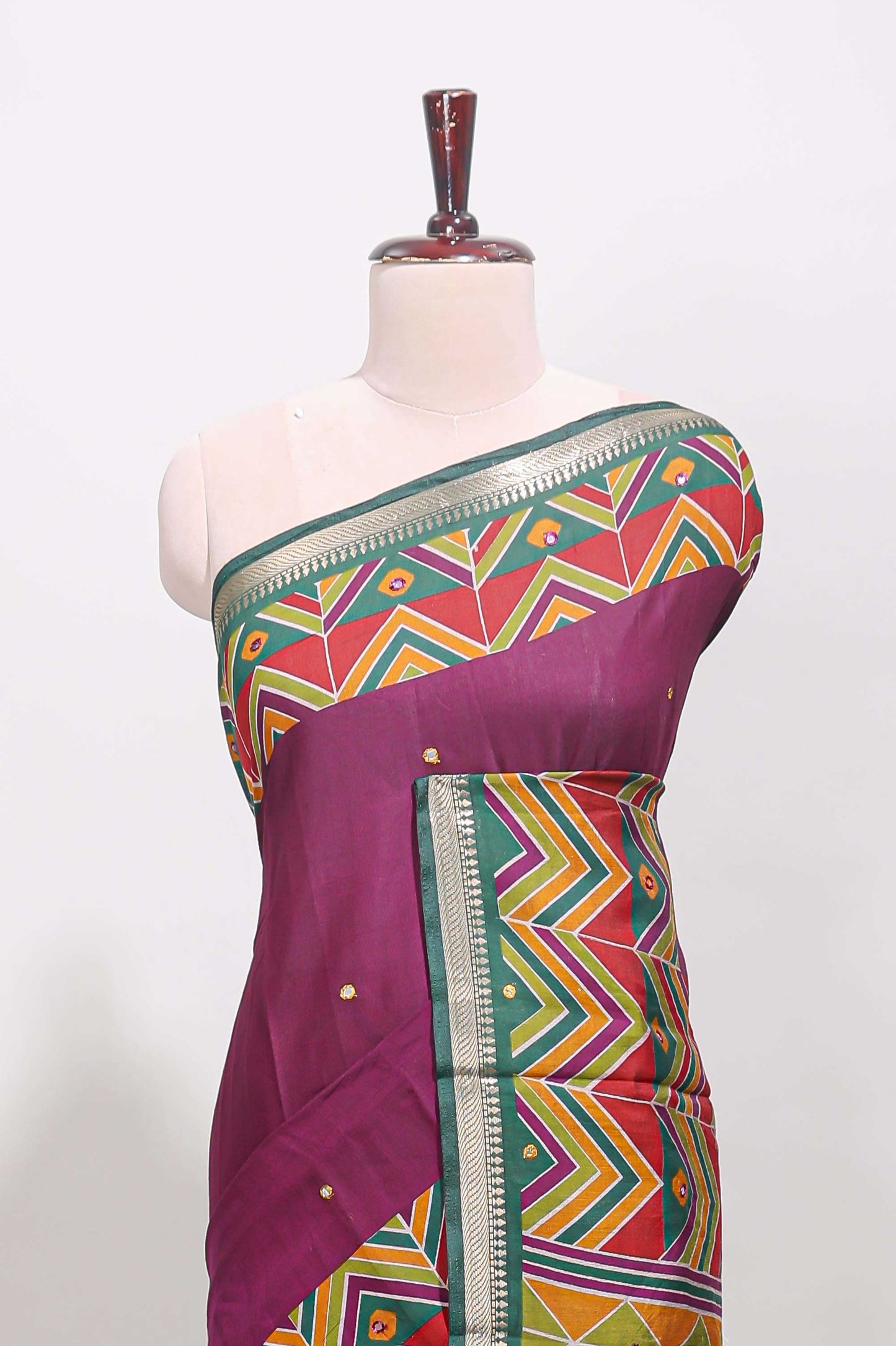 Purple embroidery mirror work viscose georgette saree with contrast chevron design zari border and printed pallu