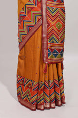 Mustard yellow embroidery mirror work viscose georgette saree with contrast chevron design zari border and printed pallu