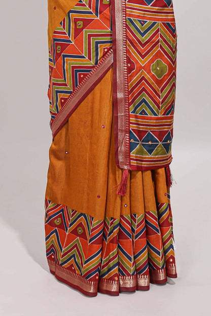 Mustard yellow embroidery mirror work viscose georgette saree with contrast chevron design zari border and printed pallu