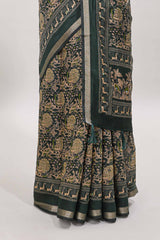 Green floral design mirror work viscose georgette saree with self zari border and printed blouse