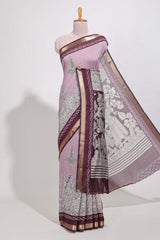 Lavender Mauve Viscose Georgette Saree All-over elegant ethnic detailing gold zari border and Statement pallu with artistic motifs with contrast printed blouse
