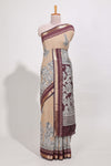 Powder Yellow Viscose Georgette Saree All-over elegant ethnic detailing gold zari border and Statement pallu with artistic motifs with contrast printed blouse