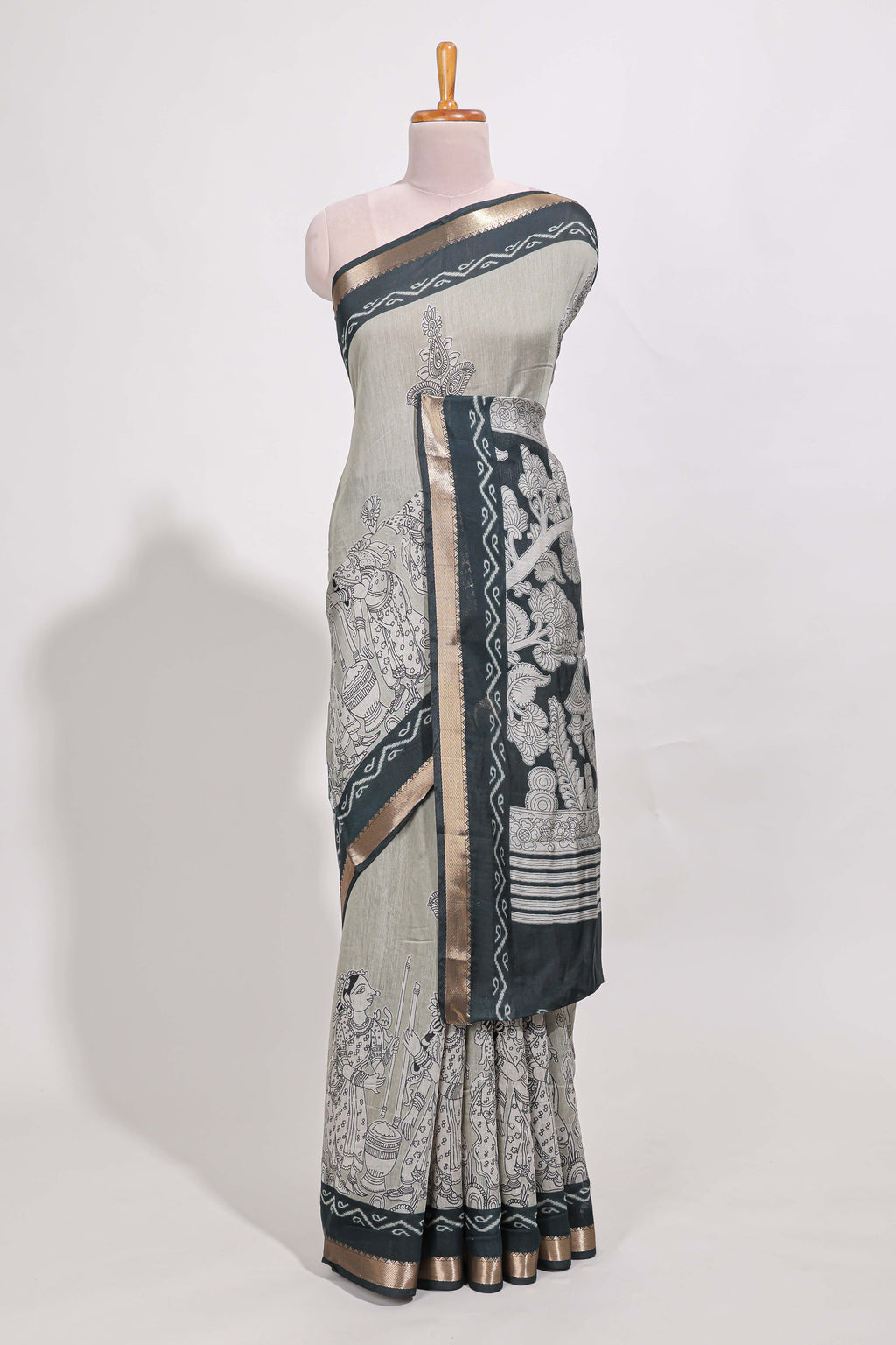 Grey colour viscose georgette saree All-over elegant ethnic detailing gold zari border and Statement pallu with artistic motifs with contrast printed blouse