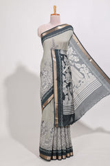 Grey colour viscose georgette saree All-over elegant ethnic detailing gold zari border and Statement pallu with artistic motifs with contrast printed blouse