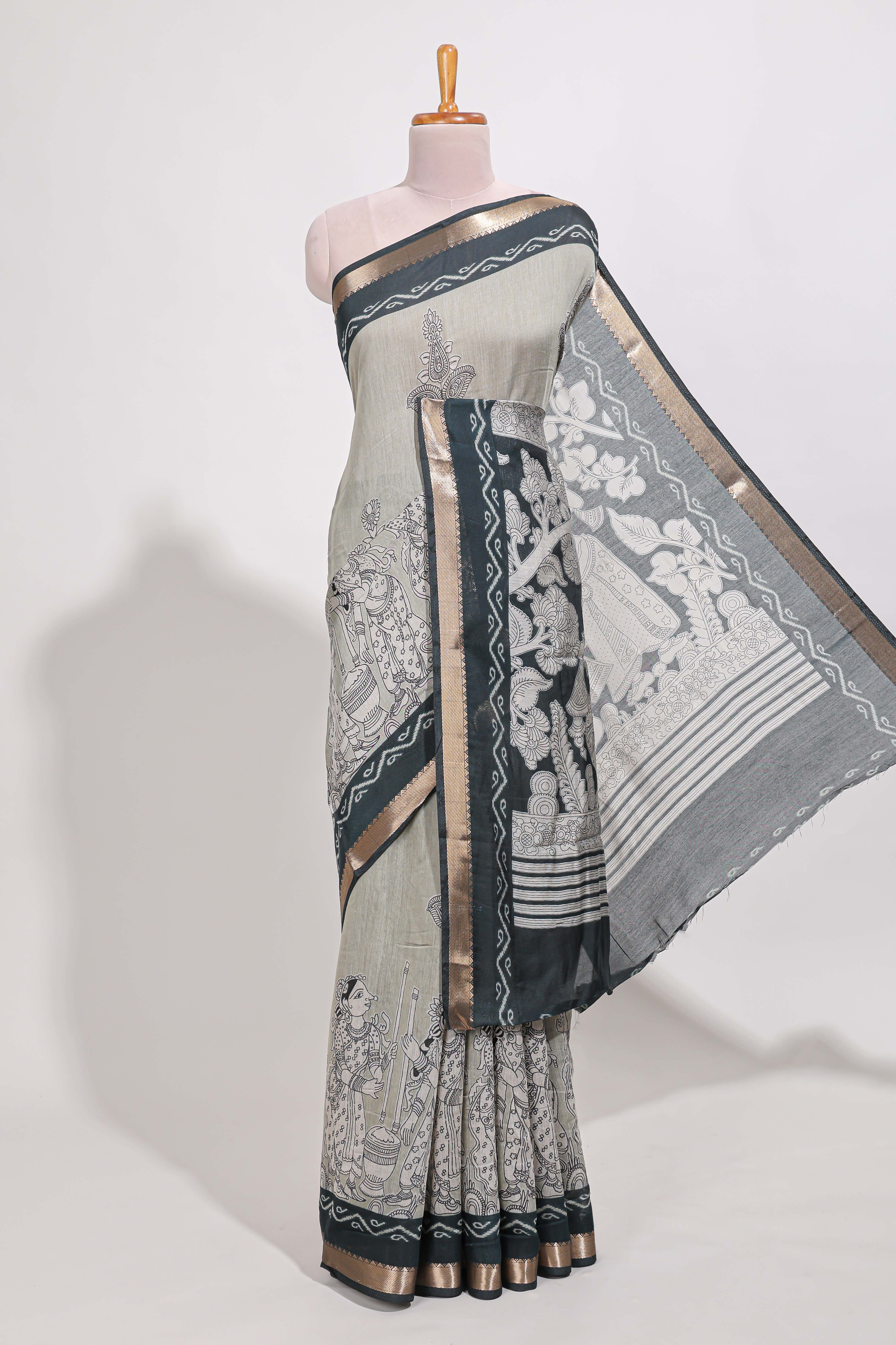 Grey colour viscose georgette saree All-over elegant ethnic detailing gold zari border and Statement pallu with artistic motifs with contrast printed blouse