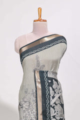 Grey colour viscose georgette saree All-over elegant ethnic detailing gold zari border and Statement pallu with artistic motifs with contrast printed blouse