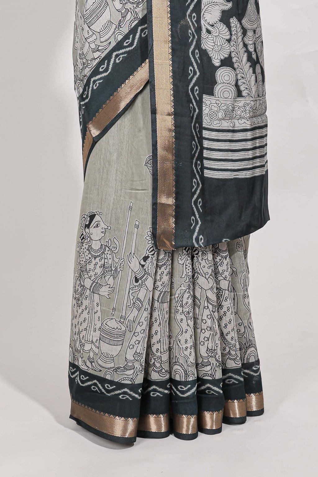 Grey colour viscose georgette saree All-over elegant ethnic detailing gold zari border and Statement pallu with artistic motifs with contrast printed blouse