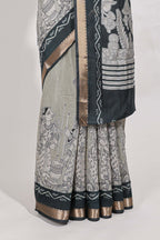 Grey colour viscose georgette saree All-over elegant ethnic detailing gold zari border and Statement pallu with artistic motifs with contrast printed blouse