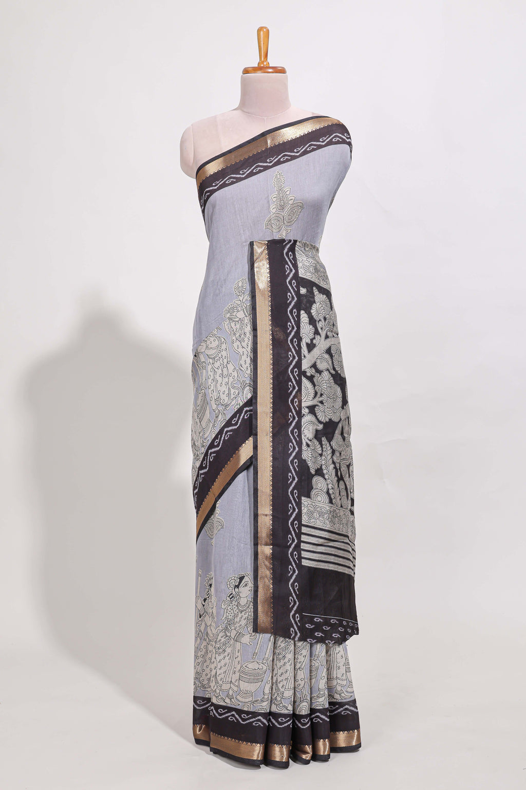 Indigo Blue colour viscose georgette saree All-over elegant ethnic detailing gold zari border and Statement pallu with artistic motifs with contrast printed blouse