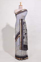 Indigo Blue colour viscose georgette saree All-over elegant ethnic detailing gold zari border and Statement pallu with artistic motifs with contrast printed blouse