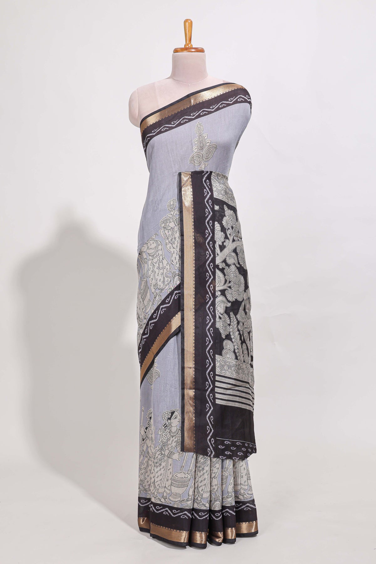 Indigo Blue colour viscose georgette saree All-over elegant ethnic detailing gold zari border and Statement pallu with artistic motifs with contrast printed blouse