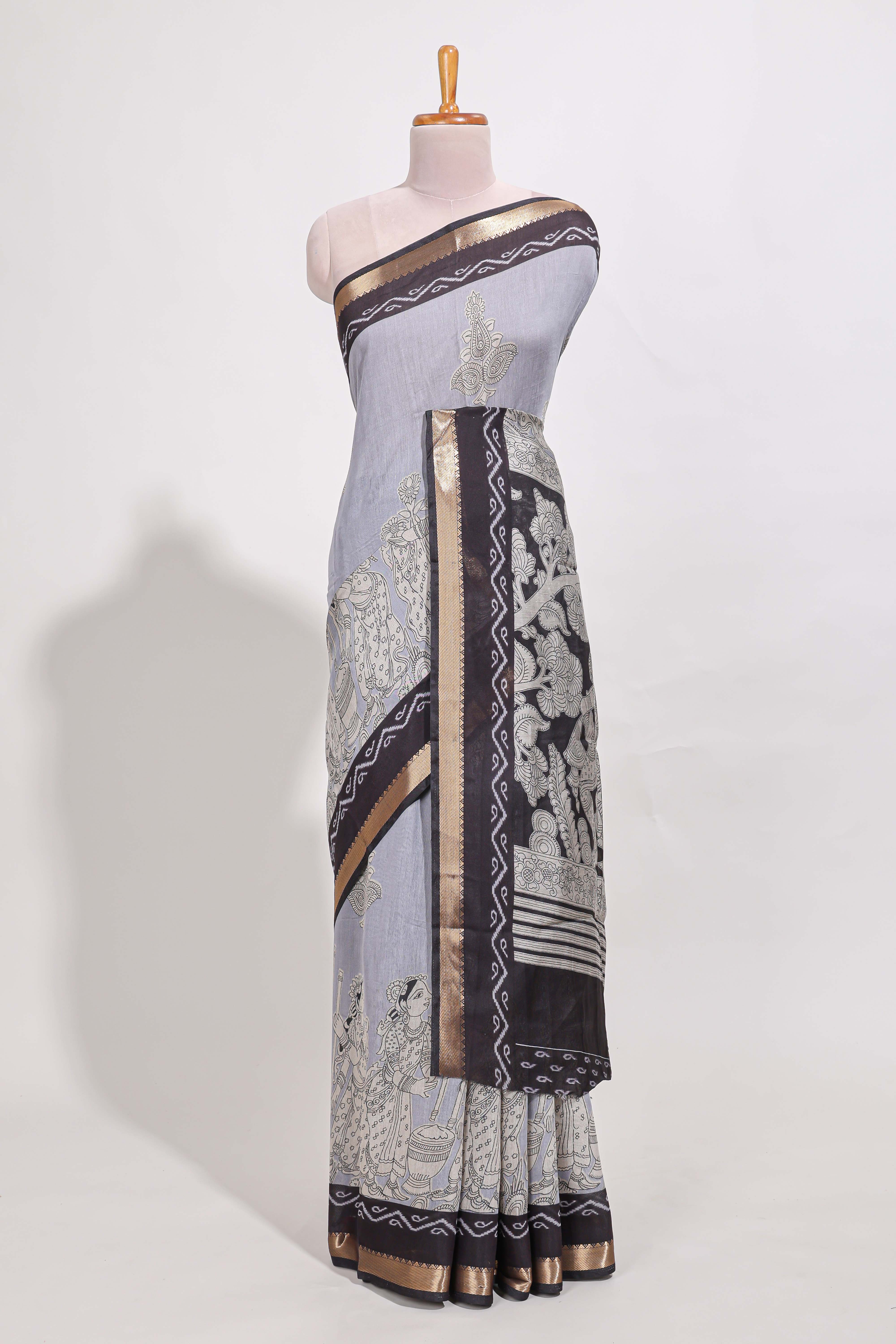 Indigo Blue colour viscose georgette saree All-over elegant ethnic detailing gold zari border and Statement pallu with artistic motifs with contrast printed blouse