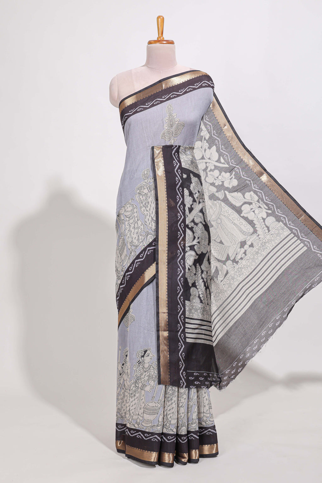 Indigo Blue colour viscose georgette saree All-over elegant ethnic detailing gold zari border and Statement pallu with artistic motifs with contrast printed blouse