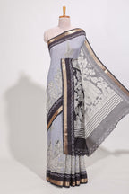 Indigo Blue colour viscose georgette saree All-over elegant ethnic detailing gold zari border and Statement pallu with artistic motifs with contrast printed blouse