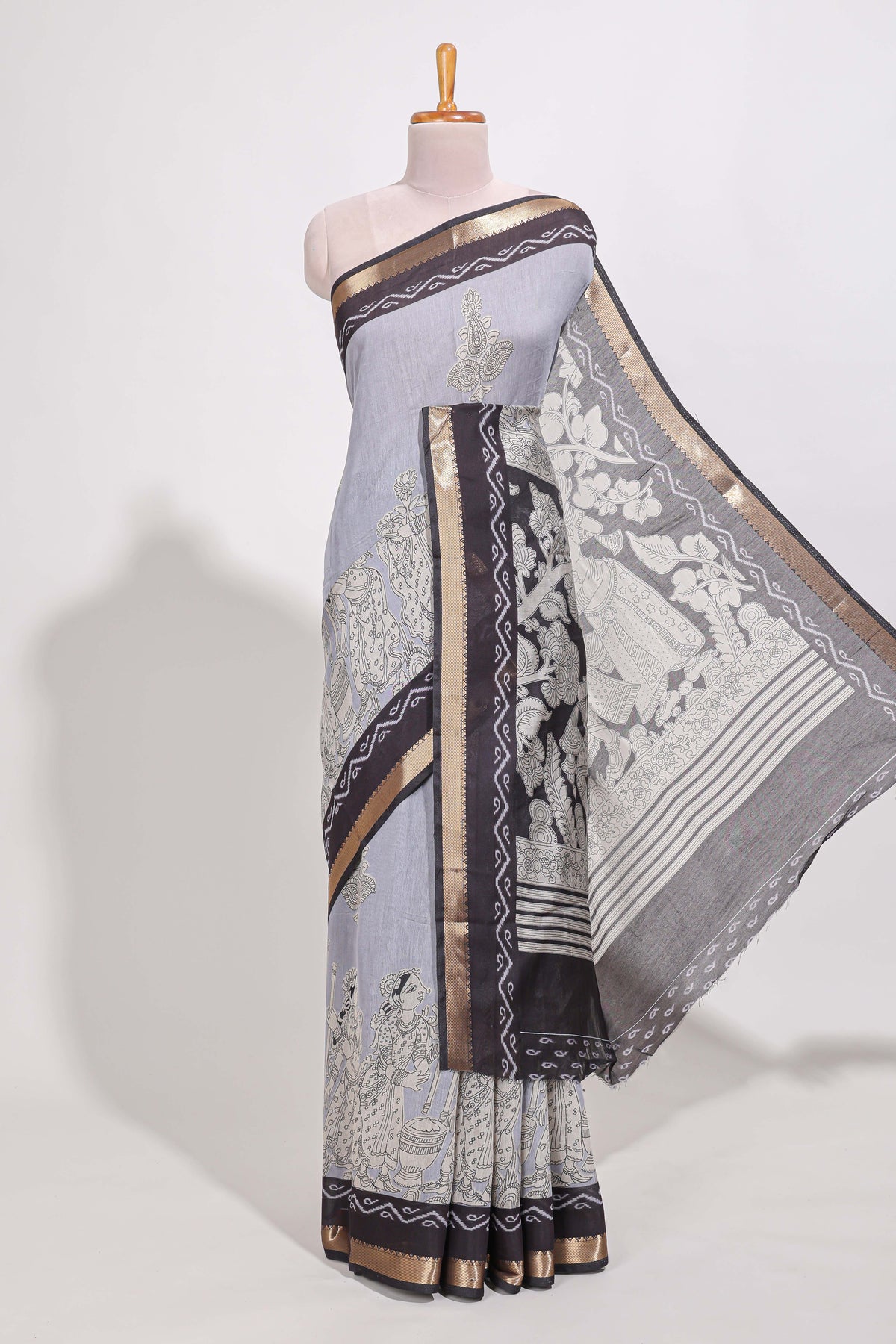 Indigo Blue colour viscose georgette saree All-over elegant ethnic detailing gold zari border and Statement pallu with artistic motifs with contrast printed blouse