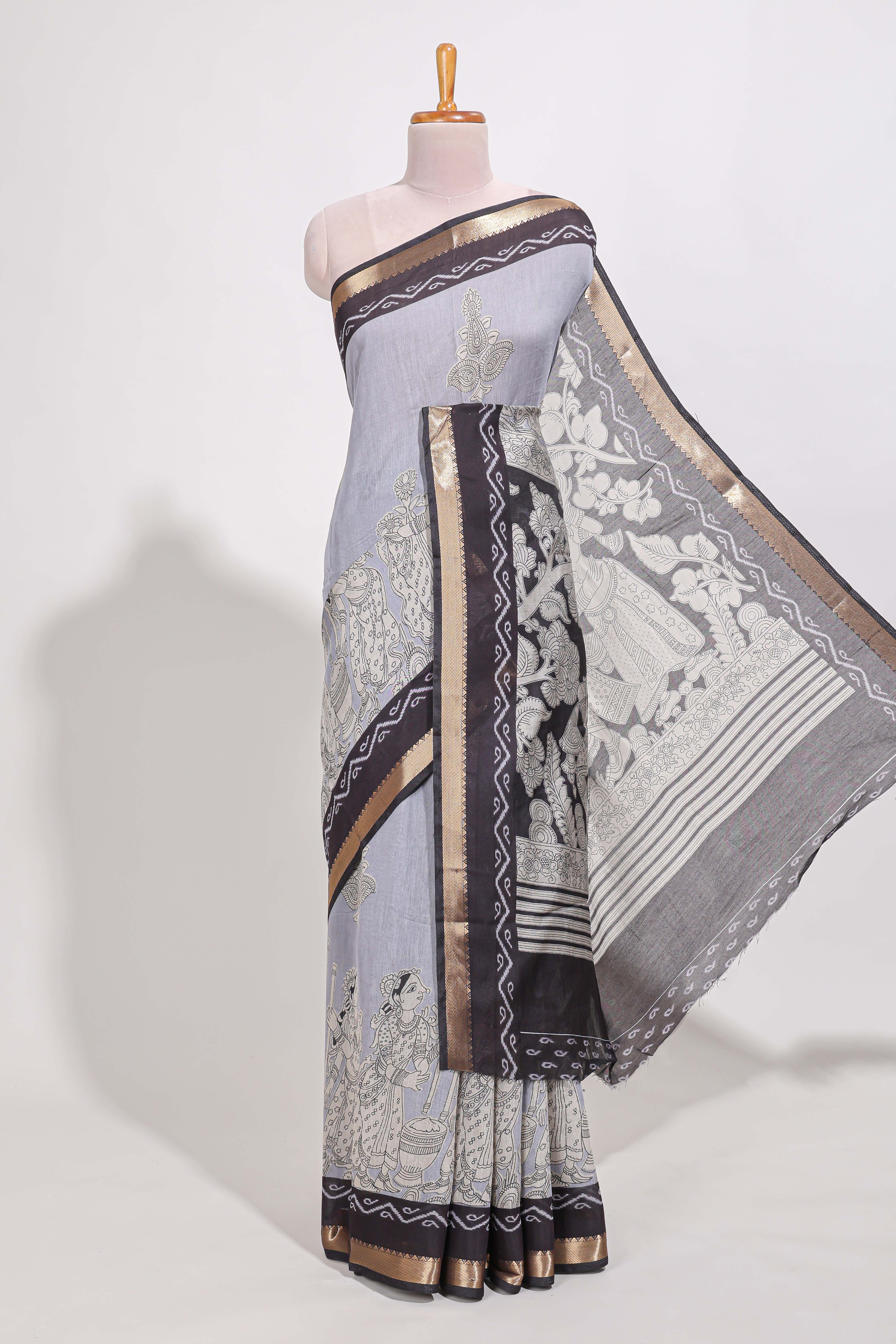 Indigo Blue colour viscose georgette saree All-over elegant ethnic detailing gold zari border and Statement pallu with artistic motifs with contrast printed blouse
